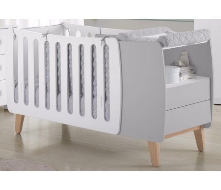 Кровать Micuna Harmony Plus Relax white / grey Кровать Micuna Harmony Plus Relax white / greyКроватки для новорожденных<br>Испанские дизайнеры для тех, кто предпочитает креатив, представляют новое изделие – необычную по форме кроватку Harmony, которая радует современным видением интерьера, необычайно стильным и функциональным подходом в решении технических задач. В комплекс входит кроватка-трансформер в виде уютной колыбельки, а также тумба для хранения постельных принадлежностей и детских вещей. Весь комплект представляет собой компактную и многофункциональную конструкцию, удобную в пользовании.<br><br><br><br>Преимущества Relax: <br> <br>- облегчает дыхание малыша при простуде; <br> <br>- снижает риск удушья в случае срыгивания; <br> <br>- снижает накопление газов; <br> <br>- значительно снижает риск «синдрома внезапной смерти».<br><br><br><br>Основные характеристики: <br> <br>- использование кроватки-трансформера в качестве спального места и колыбели и пеленального столика; <br> <br>- трансформация кроватки в специальное пеленальное место для детей до одного года; <br> <br>- изменение наклона ложа с помощью системы Relax; <br> <br>- регулирование высоты ложа в одной из двух возможных позиций; <br> <br>- использование в изделии закрытых шурупов, болтов и безопасных замков в движущихся деталях; <br> <br>- отсутствие колесиков на ножках; <br> <br>- наличие в комоде открытой полочки и двух ящиков (система «push» – для легкого открывания); <br> <br>- в комплект входит матрасик для колыбели.<br>